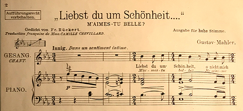 Colour facsimile (reduced) of the first system of the high-voice piano-vocal score of Liebst du um Schönheit, 1910