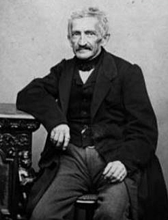 B&W photograph of Leupold von L�wenthal sitting, with his right arm resting on a table or cupboard